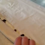 Pita sa grizom i suvim grožđem | Rolovanje pite | Postupak 3 | Slika 1/4