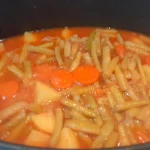 Boranija zapečena u rerni | Slaganje boranije, mesa i pečenje | Postupak 6 | Slika 3/4